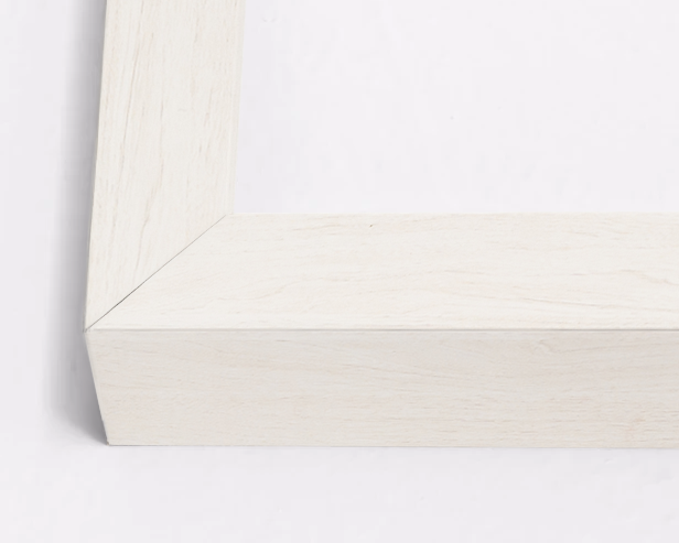 Close-up of a white wooden frame corner on a light gray background