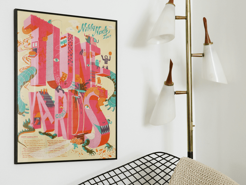 simply framed metal old school frame in matte black featuring a concert poster in an interior