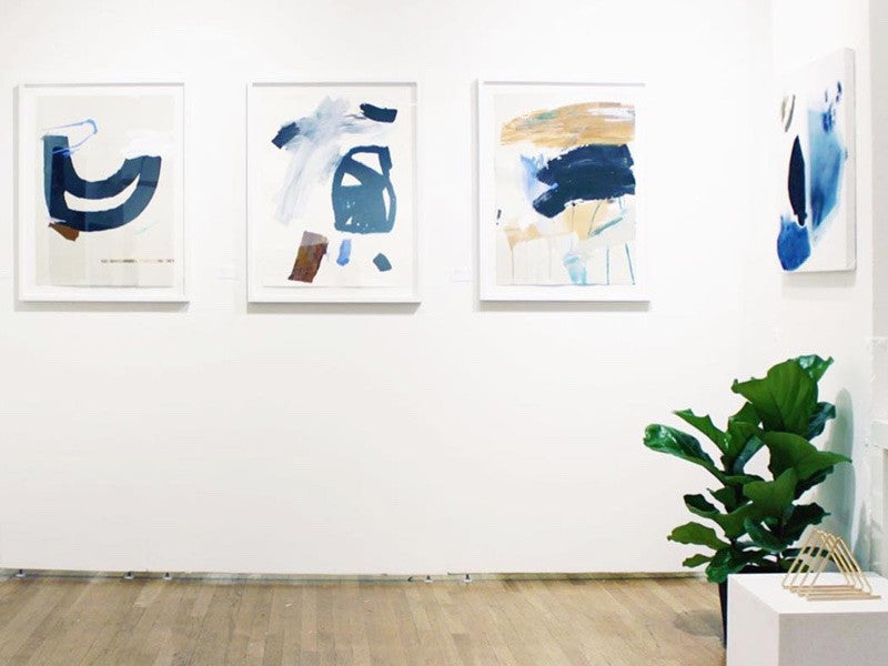 Simply Framed White Gallery Frames featuring artwork by Karina Bania in a gallery, courtesy of Uprise Art