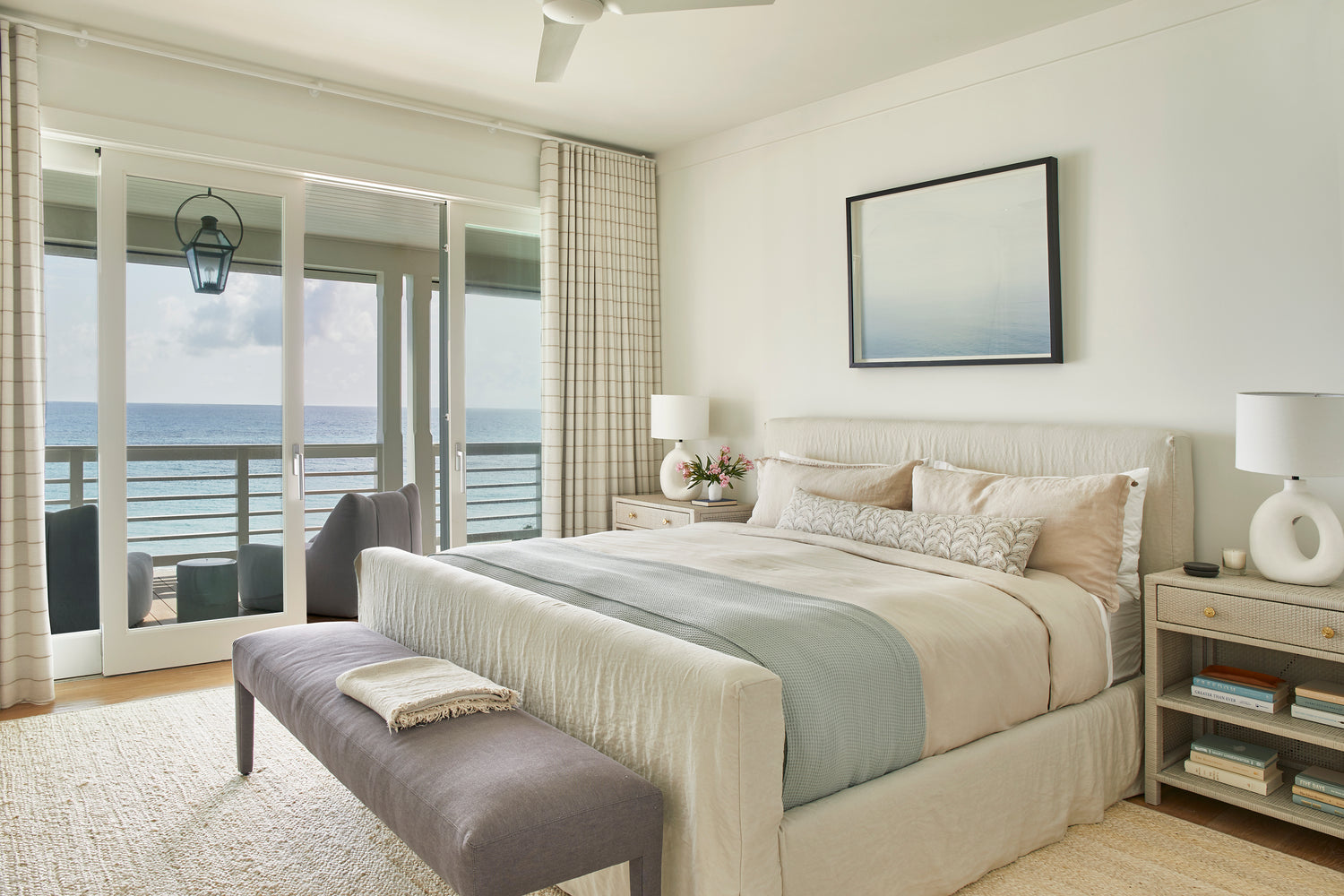 Framed ocean scene in Gallery Black above a hotel bed at the 4 seasons hotel in the bahamas