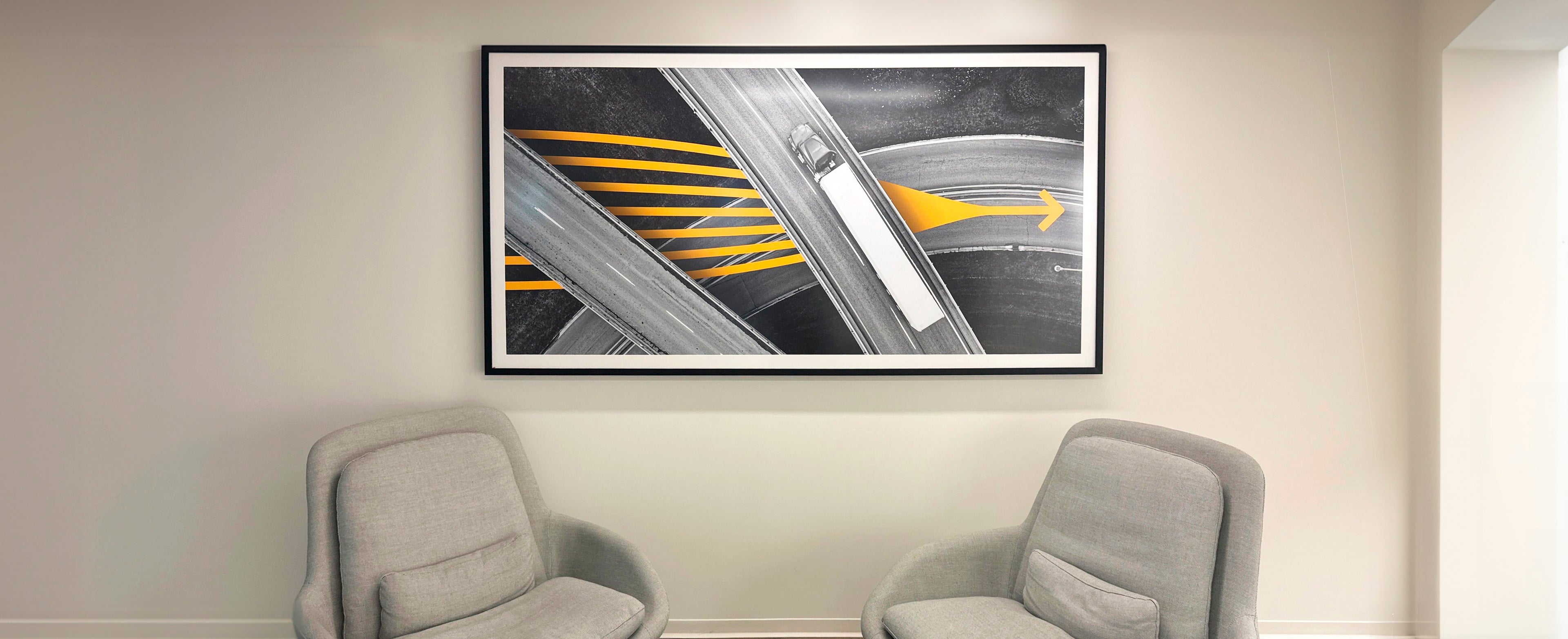 Large framed photo of a semi truck on an interstate in Loop's office waiting room